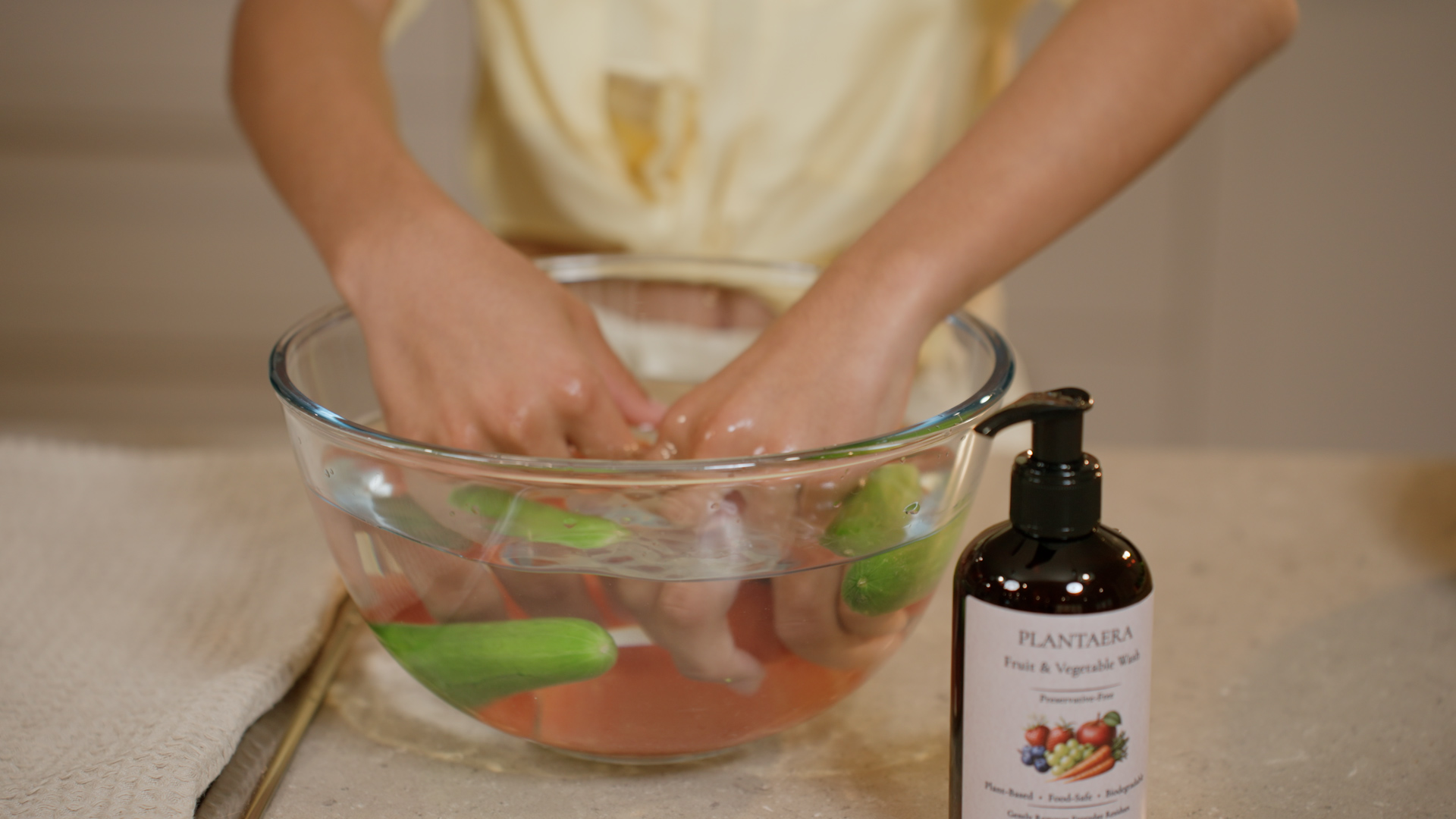 Fresh grapes being washed in a glass bowl